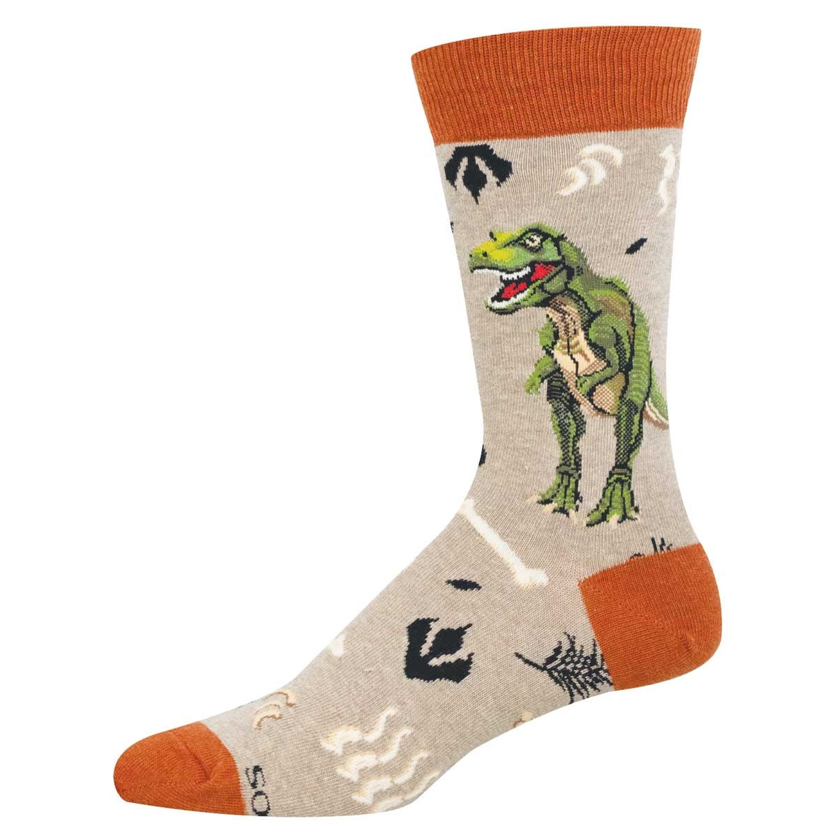 Oatmeal colored sock with orange accents featuring a t-rex surrounded by plants. footprints, and bones