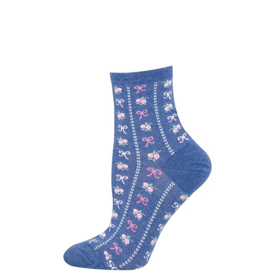 A medium blue mini crew sock with a vertical alternating bow and rose pattern